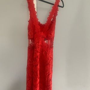 Brand new gorgeous red lace mini dress. Sheer middle w/ cross cross back straps